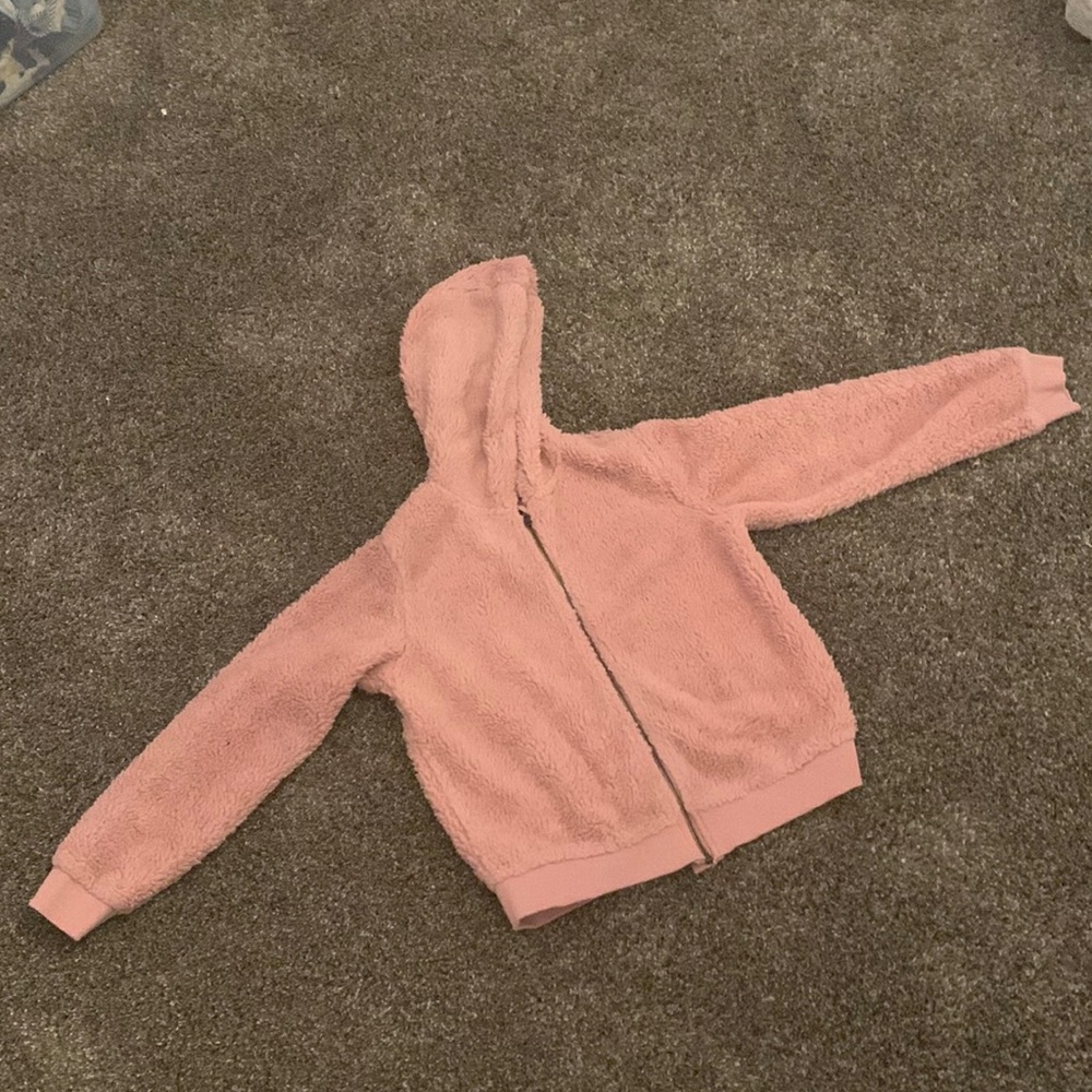 This is a pink fuzzy coat great for the winter time.